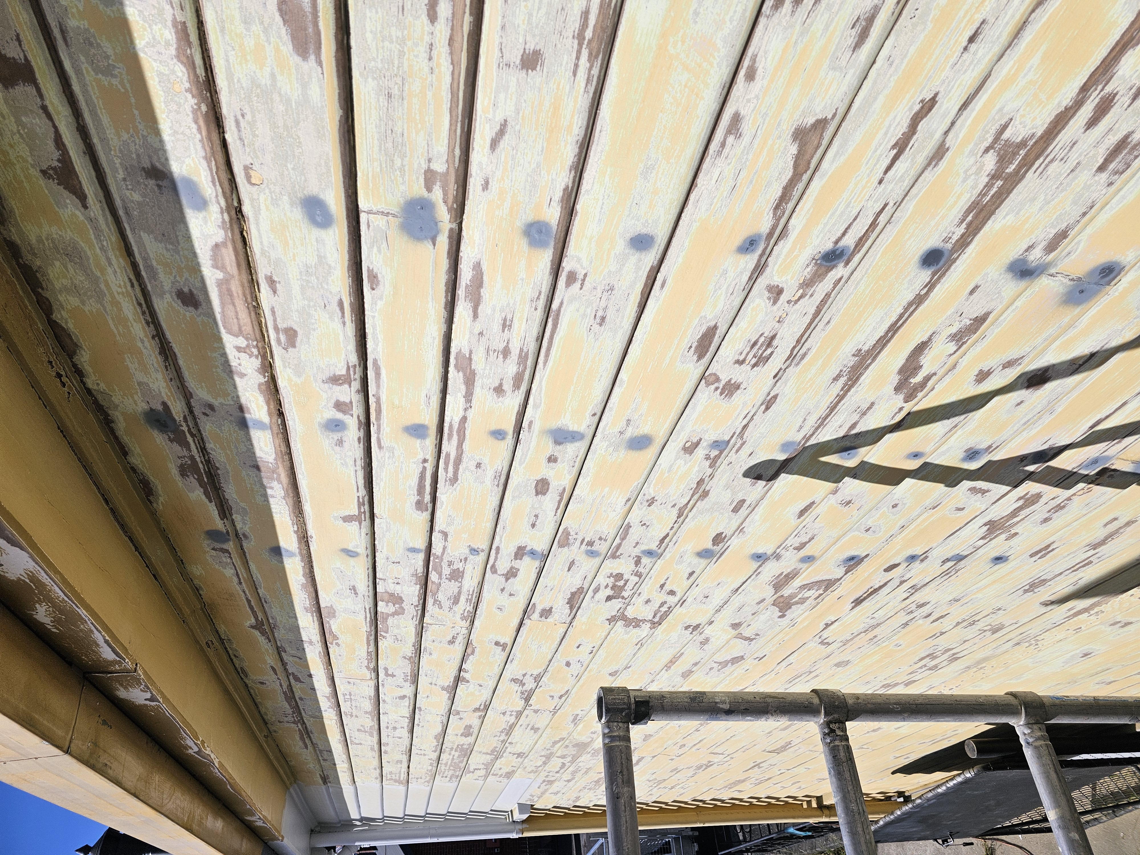sanded weatherboards with nails primed