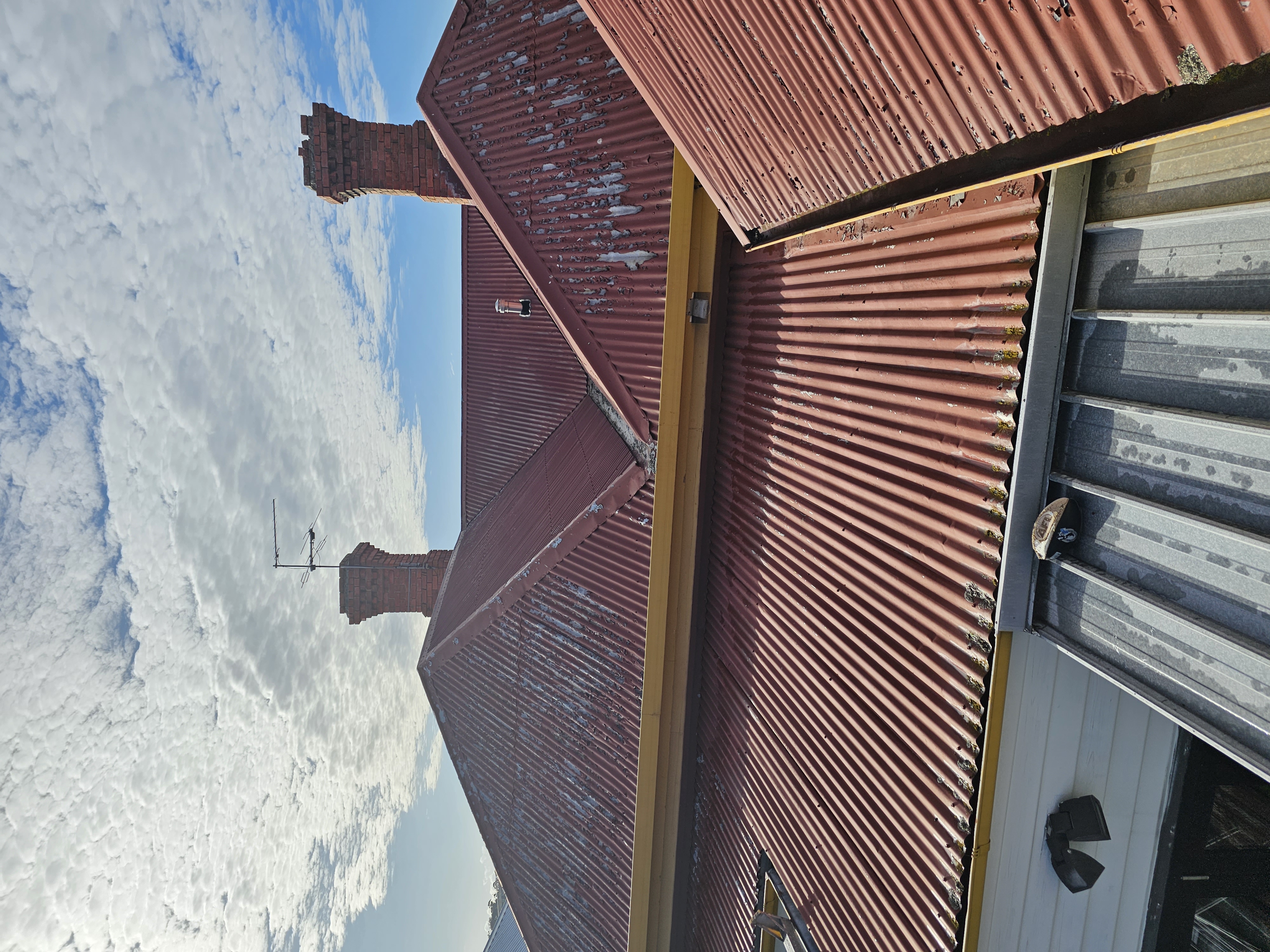 Failing roof coating prior to restoration on a heritage home in Hobart.